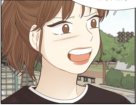 Image of brown haired girl wearing heavy make about to complain.